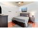 Comfortable bedroom with a large bed, hardwood floors, and natural light at 250 Pharr Ne Rd # 1914, Atlanta, GA 30305