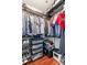 Organized walk-in closet with ample storage space for clothes and accessories at 250 Pharr Ne Rd # 1914, Atlanta, GA 30305