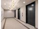 Elegant hallway with modern lighting leading to the elevators at 250 Pharr Ne Rd # 1914, Atlanta, GA 30305