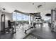 Spacious fitness center featuring weight machines and large windows with city views for a healthy lifestyle at 250 Pharr Ne Rd # 1914, Atlanta, GA 30305