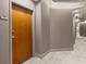 Neutral hallway with door and dark trim at 250 Pharr Ne Rd # 1914, Atlanta, GA 30305