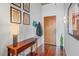 Inviting hallway features wood floors, console table and decorative wall art at 250 Pharr Ne Rd # 1914, Atlanta, GA 30305
