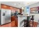 Modern kitchen features stainless steel appliances, granite island with bar seating, and sleek wood cabinets at 250 Pharr Ne Rd # 1914, Atlanta, GA 30305
