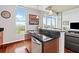 Well-equipped kitchen island with sleek countertops, modern appliances, and inviting bar stool seating at 250 Pharr Ne Rd # 1914, Atlanta, GA 30305