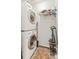 Practical laundry room with washer, dryer, and storage shelves at 250 Pharr Ne Rd # 1914, Atlanta, GA 30305