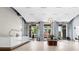 Modern lobby with marble reception desk, stylish decor, and bright natural light at 250 Pharr Ne Rd # 1914, Atlanta, GA 30305