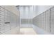 Hallway with tenant mailboxes, featuring tiled floor, and ample lighting at 250 Pharr Ne Rd # 1914, Atlanta, GA 30305