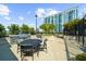 Outdoor patio area with grill, seating, and building view at 250 Pharr Ne Rd # 1914, Atlanta, GA 30305
