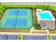 Aerial view of community tennis courts and swimming pool at 4487 Kerrington Ave, Sugar Hill, GA 30518