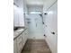 Modern bathroom with a glass-enclosed shower, and granite countertops at 4487 Kerrington Ave, Sugar Hill, GA 30518