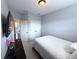 This bedroom has neutral gray walls with carpet and a television on the wall at 4487 Kerrington Ave, Sugar Hill, GA 30518