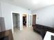 Bedroom featuring gray walls, two doors and closet and a full bathroom at 4487 Kerrington Ave, Sugar Hill, GA 30518