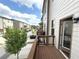 Townhome deck featuring wood flooring with a view of the community at 4487 Kerrington Ave, Sugar Hill, GA 30518