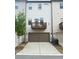 Rear exterior featuring a balcony, a two-car garage, and outdoor lighting at 4487 Kerrington Ave, Sugar Hill, GA 30518