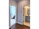 Hallway view of adjacent rooms including a sitting room and bathroom at 4487 Kerrington Ave, Sugar Hill, GA 30518