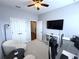 Home office features include a desk, computer, a comfortable chair and lots of light at 4487 Kerrington Ave, Sugar Hill, GA 30518