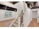 Basement with finished walls, exposed ceiling, and staircase at 4536 Mountain Creek Ne Dr, Roswell, GA 30075