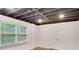 Finished basement featuring a window, door, and white paneled walls at 4536 Mountain Creek Ne Dr, Roswell, GA 30075