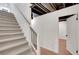 Basement staircase leading to a finished area with a door at 4536 Mountain Creek Ne Dr, Roswell, GA 30075