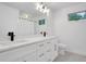 Modern bathroom featuring double sinks, white cabinetry, and sleek fixtures at 4536 Mountain Creek Ne Dr, Roswell, GA 30075