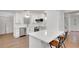 Bright kitchen features white cabinets, quartz countertops and stainless steel appliances at 4536 Mountain Creek Ne Dr, Roswell, GA 30075