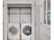 Laundry area features a washer, dryer, and shelves at 4536 Mountain Creek Ne Dr, Roswell, GA 30075