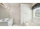 Well-lit bathroom includes double sinks, a soaking tub, and a large mirror at 538 First St, Lawrenceville, GA 30046