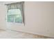 Neutral bedroom with carpet and large window at 538 First St, Lawrenceville, GA 30046