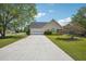 Inviting single-story home with a well-maintained lawn and attached two-car garage at 538 First St, Lawrenceville, GA 30046