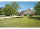 Charming single story home with well maintained lawn and a lengthy driveway at 538 First St, Lawrenceville, GA 30046