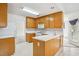 Functional kitchen featuring wooden cabinets, white countertops, and a center island at 538 First St, Lawrenceville, GA 30046