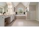 Bright bathroom featuring a soaking tub, double vanity, and tiled floors at 139 Ardsley Run, Canton, GA 30115