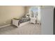 Well-lit bedroom showcasing a twin bed, neutral walls, and serene ambiance, perfect for relaxation at 139 Ardsley Run, Canton, GA 30115