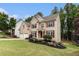 Well-maintained brick home with a lush green lawn and mature landscaping at 139 Ardsley Run, Canton, GA 30115