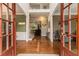 Welcoming foyer showcasing hardwood floors, elegant staircase, and views into the living spaces at 139 Ardsley Run, Canton, GA 30115