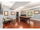 Spacious game room with pool table, hardwood floors, bar and plenty of natural light at 139 Ardsley Run, Canton, GA 30115