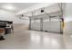 Clean and organized garage featuring two doors, ample storage, and epoxy floors at 139 Ardsley Run, Canton, GA 30115