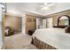 Spacious main bedroom with a tray ceiling, sitting area, and a walk-in closet at 139 Ardsley Run, Canton, GA 30115