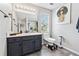 Well-lit bathroom featuring a modern vanity and a stylish black and white marble-walled shower at 2349 June Springs Sw Dr, Marietta, GA 30008