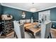 Dining room featuring wainscotting, a wine rack and large wooden table at 2349 June Springs Sw Dr, Marietta, GA 30008
