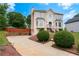 Two-story home with well-manicured landscaping and large driveway at 2349 June Springs Sw Dr, Marietta, GA 30008