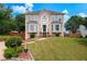 Charming two-story home with a well-manicured lawn at 2349 June Springs Sw Dr, Marietta, GA 30008