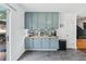 Bright and airy kitchen with grey cabinets, modern countertops, and stainless steel appliances at 2349 June Springs Sw Dr, Marietta, GA 30008