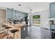 A kitchen with grey cabinets, stainless steel appliances and a sliding glass door to the backyard at 2349 June Springs Sw Dr, Marietta, GA 30008