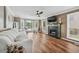 Bright living room with a fireplace, hardwood floors, and many windows at 2349 June Springs Sw Dr, Marietta, GA 30008