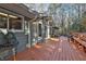 Spacious back deck includes bench seating and a view of the green home exterior at 337 Andrew Bailey Rd, Sharpsburg, GA 30277