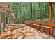 Spacious back deck with built in bench seating offers serene view of the wooded yard at 337 Andrew Bailey Rd, Sharpsburg, GA 30277