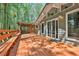 Beautiful backyard deck with outdoor seating, wood railing, and a sliding glass door entrance at 337 Andrew Bailey Rd, Sharpsburg, GA 30277
