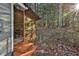Screened in back porch area surrounded by nature at 337 Andrew Bailey Rd, Sharpsburg, GA 30277