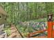 Landscaped backyard with a garden, stepping stone path and wooden stairway at 337 Andrew Bailey Rd, Sharpsburg, GA 30277